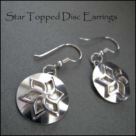 E - Star topped disc earrings