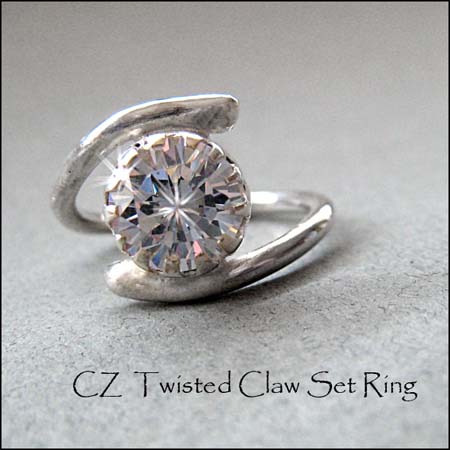 R - CZ Twisted Claw Set Ring